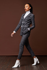 Sexy beautiful woman fashion glamour model brunette hair makeup wear suit trousers jacket clothes...