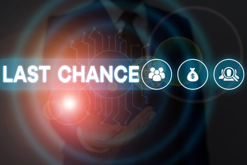 Text sign showing Last Chance. Business photo showcasing final opportunity to achieve or acquire something or action Male human wear formal work suit presenting presentation using smart device