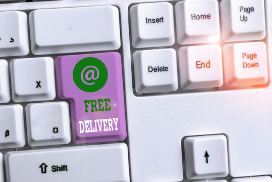 Text sign showing Free Delivery. Business photo text Shipping Package Cargo Courier Distribution Center Fragile White pc keyboard with empty note paper above white background key copy space