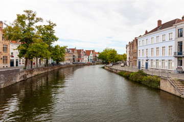 Naklejka premium Langerei Canal running through quiet area of Brugge, Bruges, Belgium