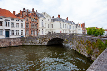 Fototapeta na wymiar Small stone bridge across Langerei Canal, Brugge, Bruges, Belgium