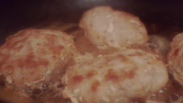 juicy cutlets made from minced meat fried in a metal pan.close-up.shallow depth of field.