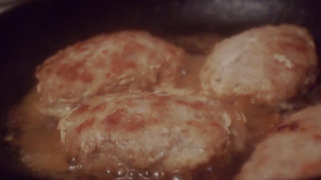 juicy cutlets made from minced meat fried in a metal pan.close-up.shallow depth of field.