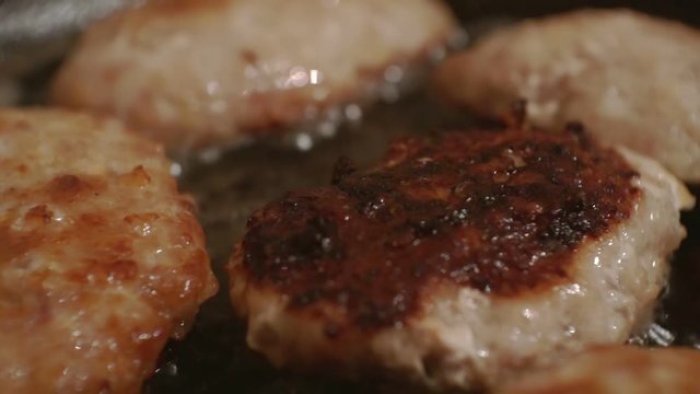 juicy cutlets made from minced meat fried in a metal pan.close-up.shallow depth of field.