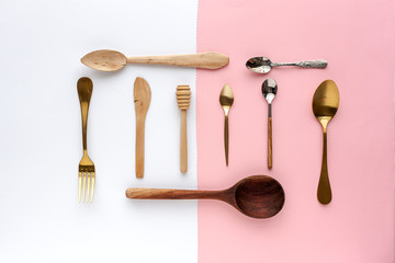 Spoons and forks on colors background