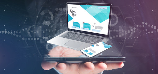 Businessman holding a Laptop and a smartphone - 3d rendering