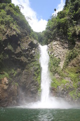 Fototapeta na wymiar BANAUE, PHILIPPINES - June 03 2016: Rock, pool and waterfall in Batad, near Banaue 