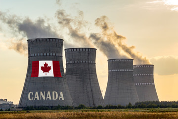 Nuclear plant chimneys displaying flag of Canada with according text. Energy pollution accidents in...