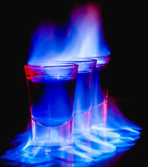 burning drink in shot glass