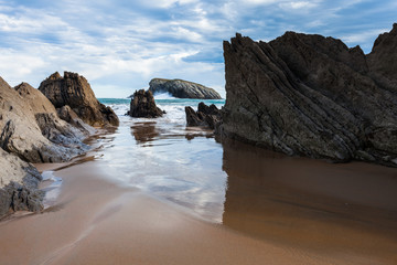 Fototapeta premium Flysch rock formation at a north atlantic ocean beach in spain near bilbao and santander during winter time.