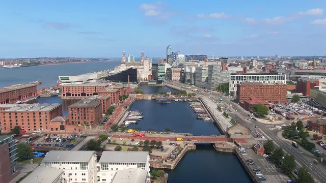 liverpool landmark tourist attraction albert dock aerial view drone flying backwards