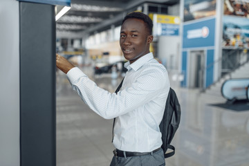Naklejka premium Businessman at coffee machine in car dealership