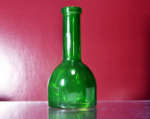 green bottle on brown background