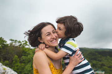 Fototapeta premium The boy hugs mom.