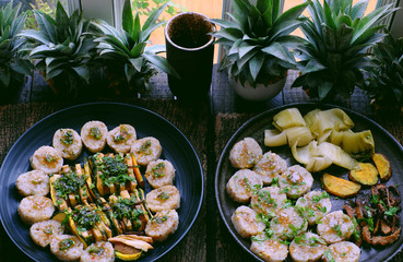 Top view vegan Vietnamese eating indoor restaurant, vegetarian rice rolls cut in slice with vegetable