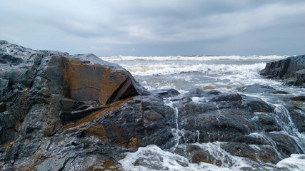 SEA WATER HITTING THE BIG STONES  ON SEA SIDE