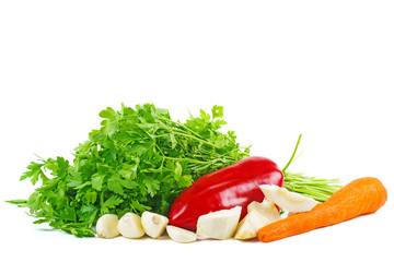 Vegetables: carrot, bell pepper, garlic, parsley and dill leaves isolated on white background