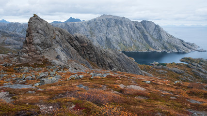 Beautiful cliffs above the fishing town of Nusfjord, fjord and sea Norway, Lofoten Islands,