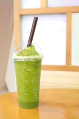 Green tea blended on the table in the dessert shop.