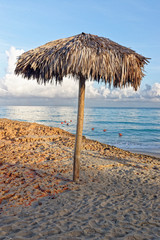 Woven straw beach umbrella