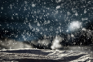 Christmas background with space for advertising products and decorations. Snowy glimmering and...