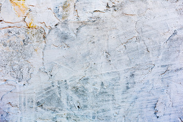 Texture of a concrete wall with cracks and scratches which can be used as a background