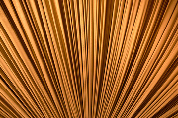 Gold colored fabric stretched diagonally as a background.