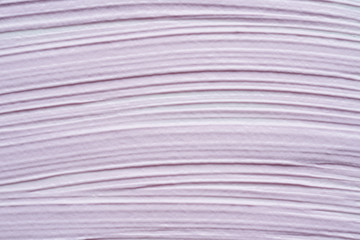 Gently purple texture and strokes of a facial cleansing mask or acrylic paint isolated on a white background