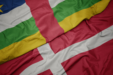 waving colorful flag of denmark and national flag of central african republic.