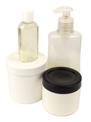 A set of containers for cosmetic products on a white background