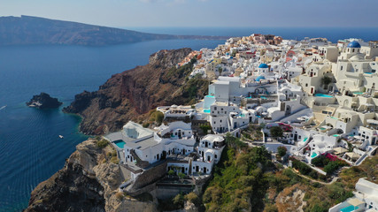 Fototapeta na wymiar Aerial drone photo of traditional and picturesque village of Oia in volcanic island of Santorini, Cyclades, Greece