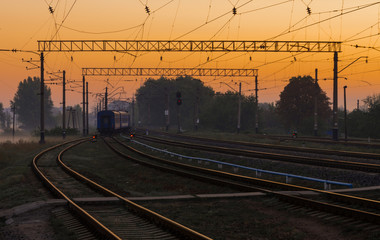 Fototapeta na wymiar Living passenger train on sunrise