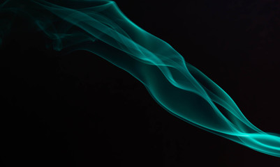 Incense smoke spiral colors on black background
