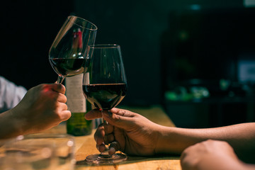 Waitress man pouring wine into glass