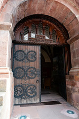 Detail of a wooden and wrought iron door of church in France