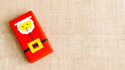 Obraz premium Christmas background with copy space. Top view of DIY santa gift boxes . Celebration of winter holidays concept