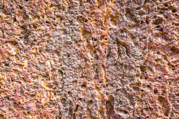 The porous texture of volcanic mineral. The geological structure of the stone. Abstract background...