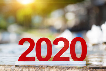 Digit 2020 at the city fountain. Figures 2020 are the symbol of the coming year on the edge of the...