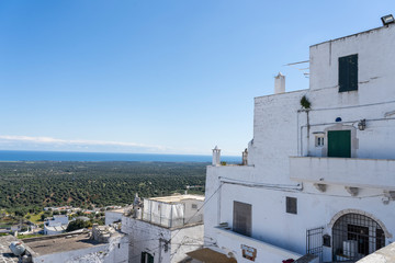 Fototapeta premium Ostuni, Puglia Italy - April 30, 2019: City of Ostuni, historical center . The White City of Puglia. Mediterranean southern Italy. city wall in Ostuni.