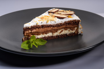 delicious cake with chocolate cream on a black plate10