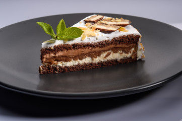 delicious cake with chocolate cream on a black plate7