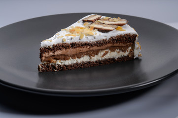 delicious cake with chocolate cream on a black plate2