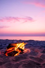 Acrylic prints Beach sunset Fire on beach with pink sunset