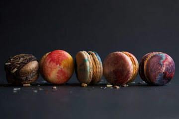 colorful macaroons on dark background