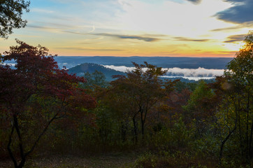 View of the fog covered valley below. Taken from the top of Morrow Mountain State Part NC