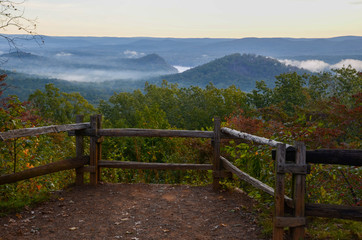 Fototapeta na wymiar View of the fog covered valley below. Taken from the top of Morrow Mountain State Part NC