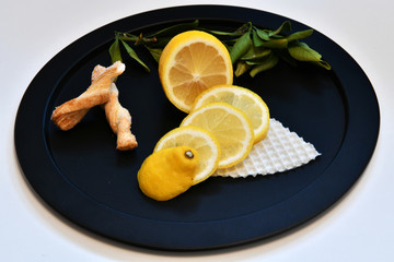 lemon and baking on a black plate