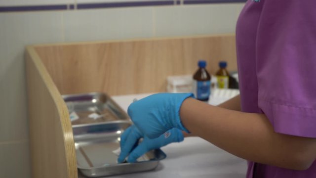 Gloved doctor's hands preparing vaccine for vaccination. Close-up