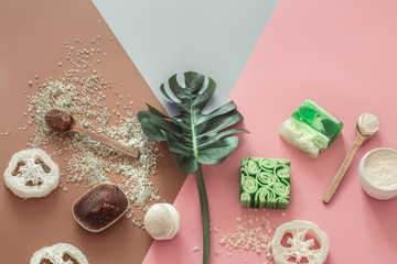 Spa composition with body care items on a colored background.