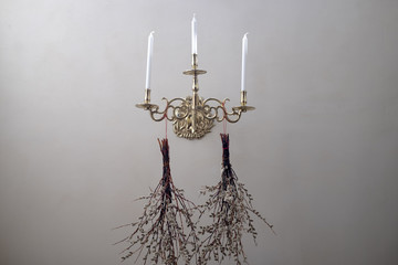 Old light with candles and a cross.